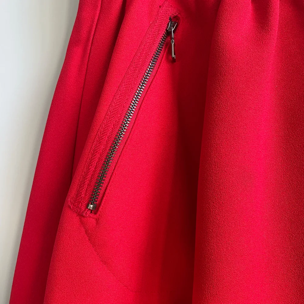 A-Line red skirt with Zip Pockets. Elastic Waistband. Size XS. Kjolar.