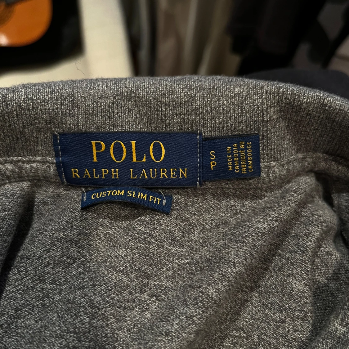 Grå pikétröja från Ralph Lauren - 90