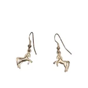 Silver horse earrings with minor color fallout because of age   