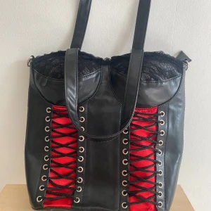 Living dead souls Corset bag - Black corset bag with red details.  Used a few times but good condition, a few scratches.