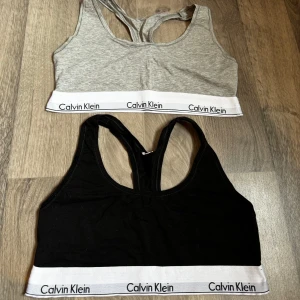 Calvin Klein toppar storlek L - Två st Calvin Klein toppar i storlek L. Använda några få gånger var så i perfekt skick. Säljes tillsammans i ett paket för 250kr