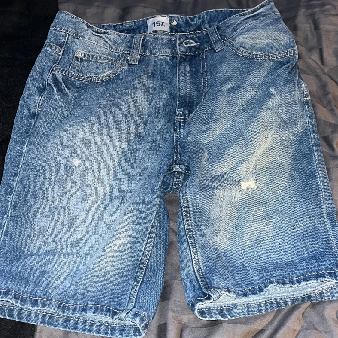 Blå jeansshorts från 157