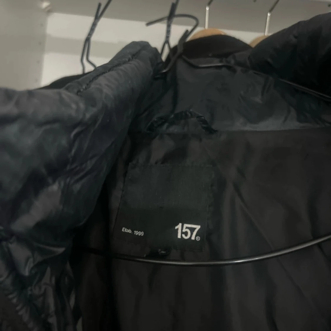 Svart lång pufferjacka från 157 - 90