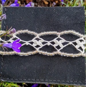 🌱 the snow drop bracelet 🌬️ - 🌱 the snowdrop bracelet 🌬️  crocheted and made to order by me ❤️ hardware is 100% nickel free stainless steel, beads are seed beads made of glass 🩵 i starch them using corn starch, so let me know if you have any allergies and i will use something different 🌞   -------------------   #crochet #fairy #handmade #lace #summer
