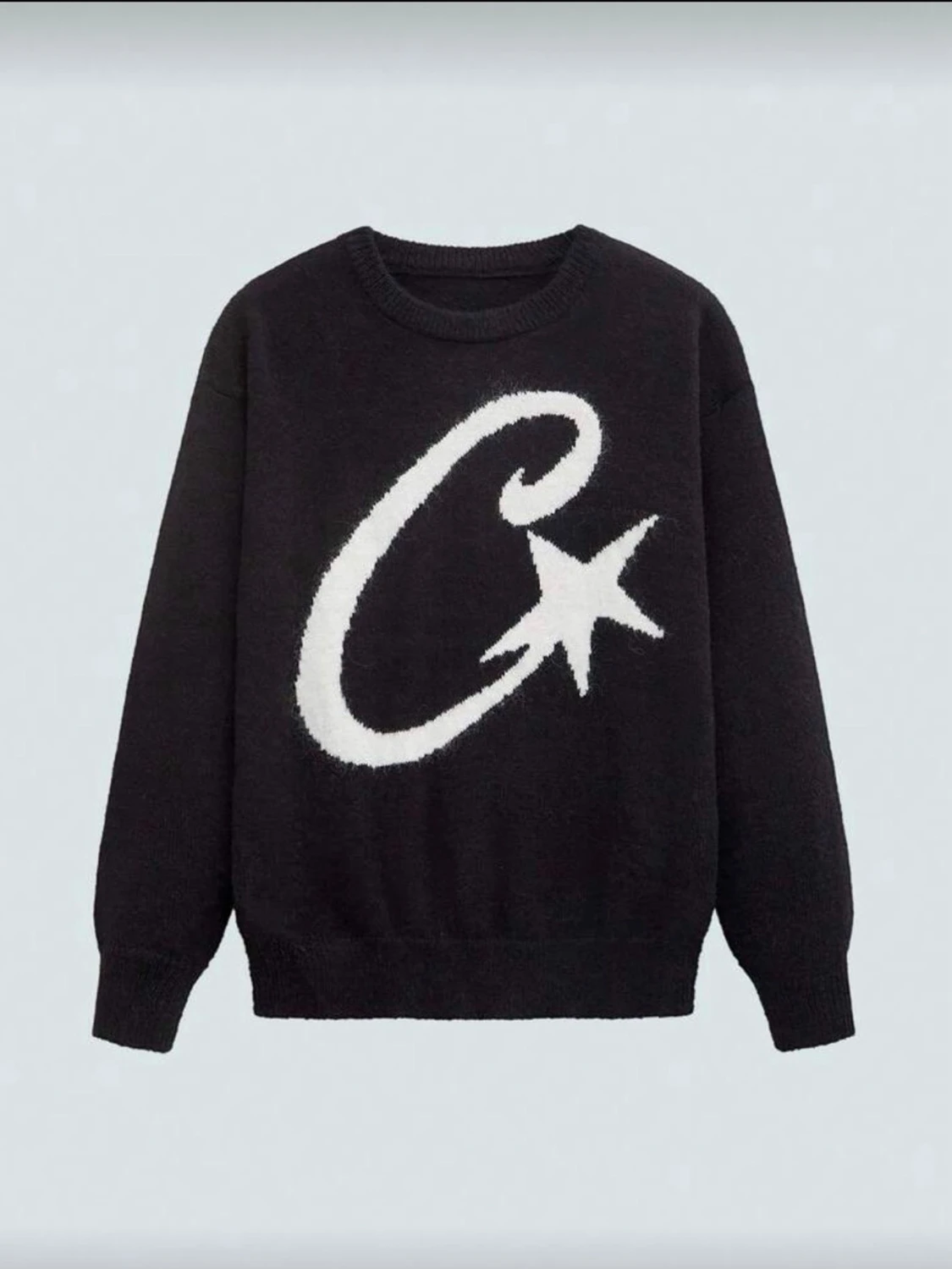 Svart stickad tröja med stjärntryck