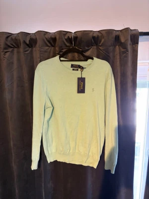 Ralph Lauren Tröja - Blå turkos pima bomullströja från Ralph Lauren. Använd få gånger i toppskick. Prislapp tillkommer.