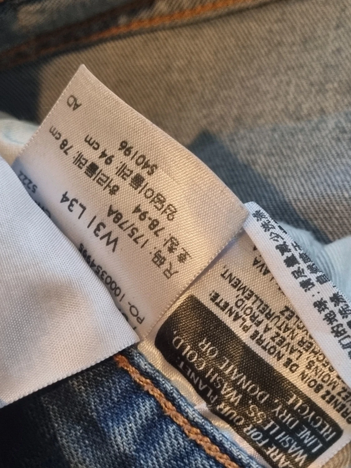 Ljusblå slitna Levi's jeans 34 34  - 2
