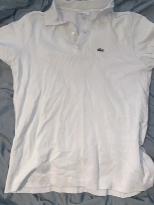 Lacoste piké  - Storlek 16 passar 176cm
