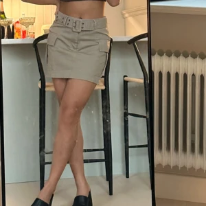 Mini kjol - Från Gina  Storlek 34 