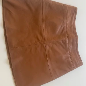 Copenhagen muse skinnkjol - Fin ljusbrun äkta skinnkjol Endast använd fåtal ggr Strl S 