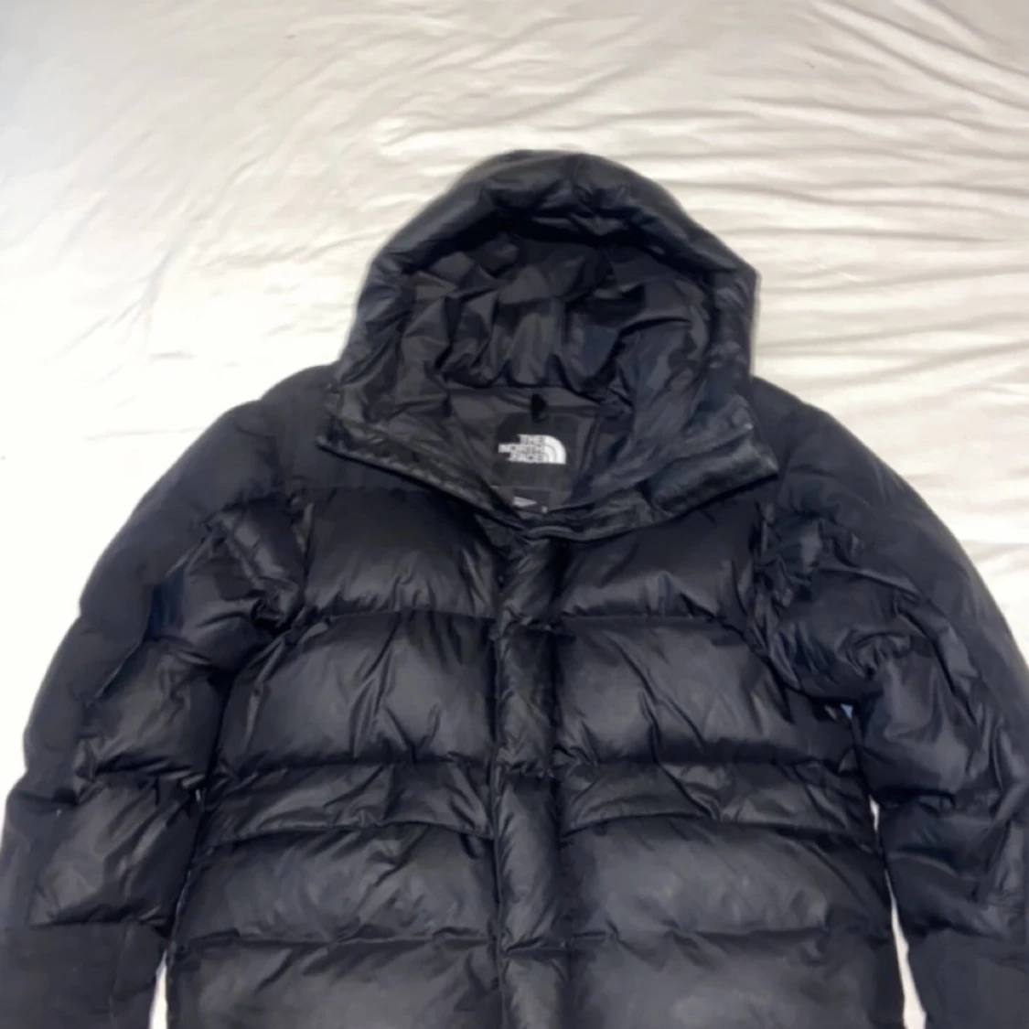 Svart dunjacka från The North Face - 90