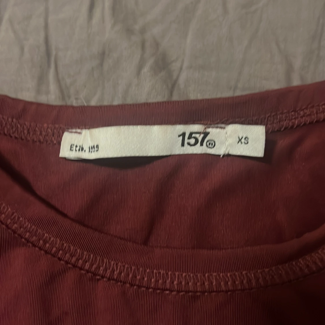 Vinröd långärmad topp från 157 - 90