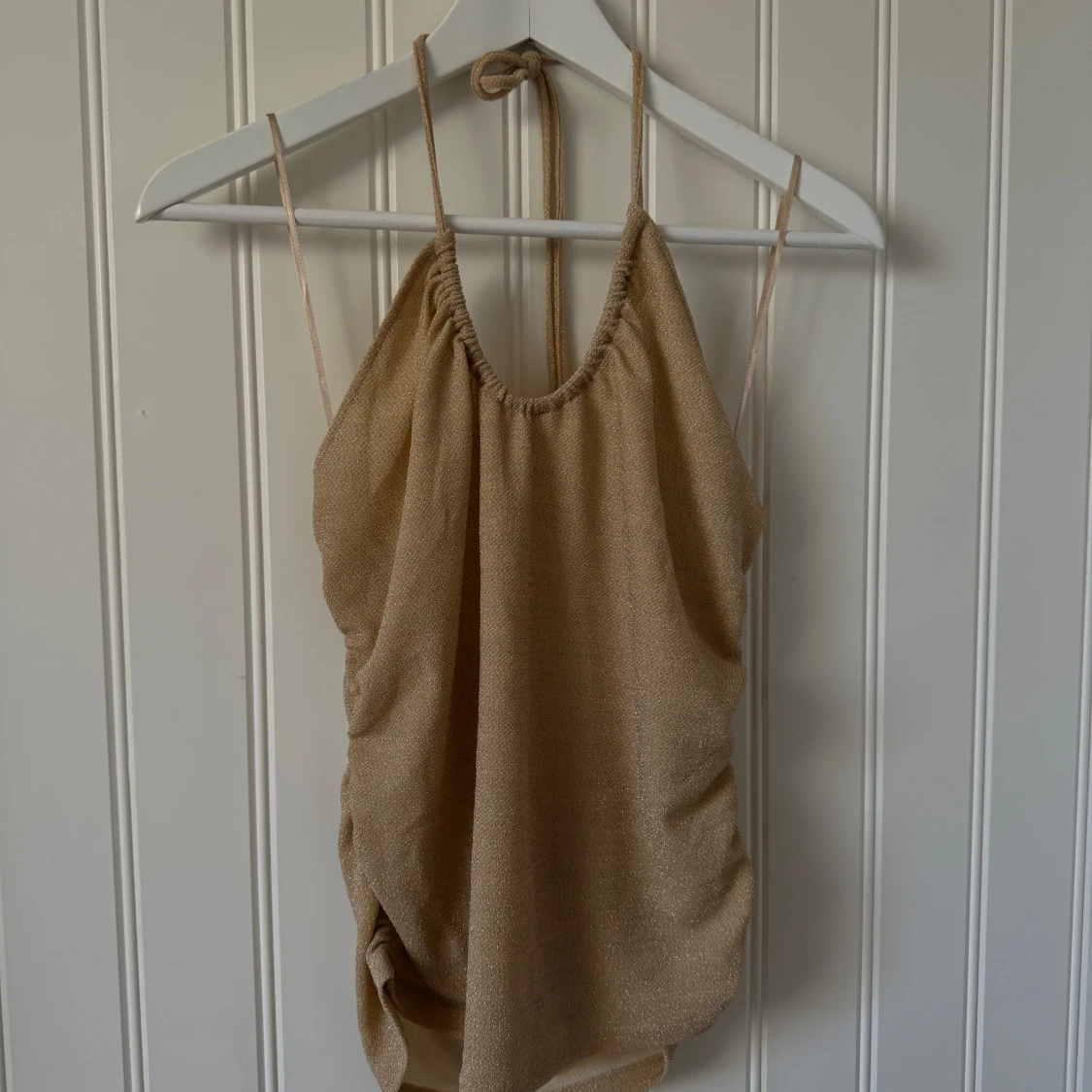 Glittrig festtopp/linne