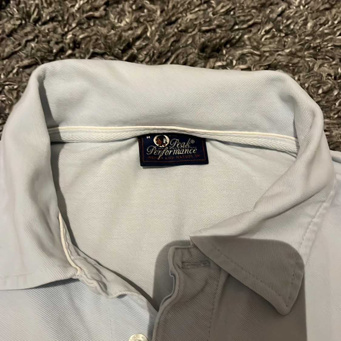 Ljusblå pikétröja från Peak Performance - 90