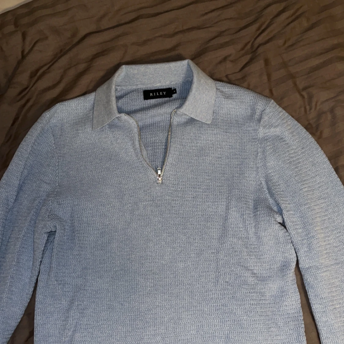 Ljusblå tröja från Riley