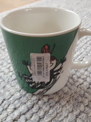 Muminmugg grön Lilla My Mumin  - Felfri mugg med etikett kvar. Säljer fler Muminmuggar så kika gärna på mina övriga annonser också. Packar mycket noggrant. 