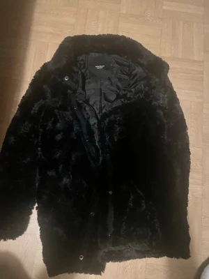 Black Faux Fur Coat - This is a black faux fur coat from the brand Vero Moda. 