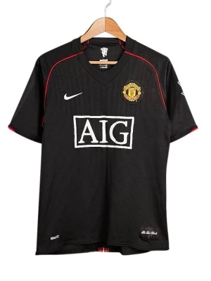 Ronaldo Man United Away Shirt 2007/08 Premier League - Snygg vintage svart Manchester United matchtröja med röda detaljer, officiellt klubbmärke och AIG-logga på bröstet. Nummer 7 och Ronaldo på ryggen samt Premier League-patchar på ärmarna. Tillverkad i lätt och ventilerande material, perfekt för fotboll eller streetwear.