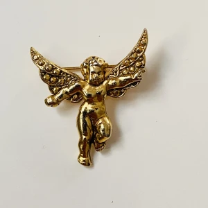 Brosch  - Guldfärgad brosch kerub 