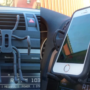 Mobilhållare  - Passar för alla typer av telefoner, en eller två, GPS, mindre plattor mm.  Formas enkelt efter dina behov och fästes i fläktgallret.  Kräver inga verktyg och lämnar inga som helst märken på varken bilen eller tel.