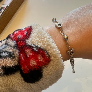 Fotlänk / armband - Fotlänk (eller armband) med Mimmi / Musse Pigg mönster