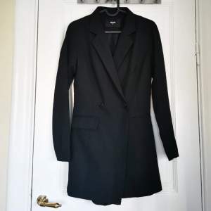 It is a jumpsuit, but looks like a blazer with a short included. Fits super nice. New without tag 