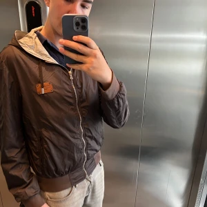 Dolce Gabbana Windbreaker size L -  Dolce Gabbana windbreaker Cond: 8/10 A few tiny holes as shown in the pictures. Size XL- Fits like M-L Bin: 1900sek