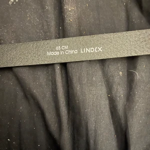 Ett skärp  - Ett svart skärp 65 cm lång 