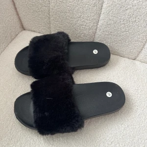 Tofflor - Aldrig använda. 