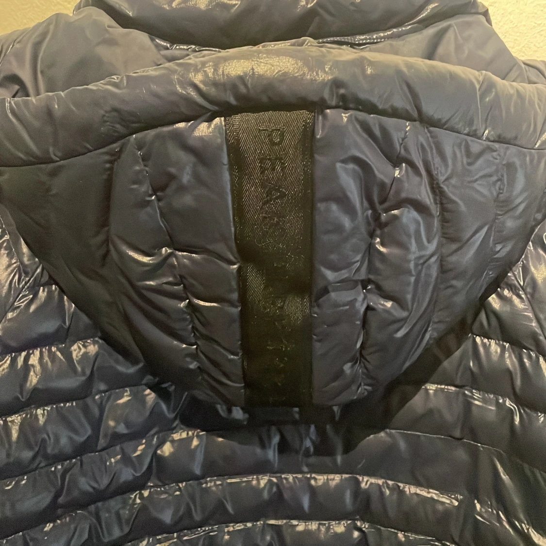 Mörkblå pufferjacka från Peak Performance storlek (170) - 2