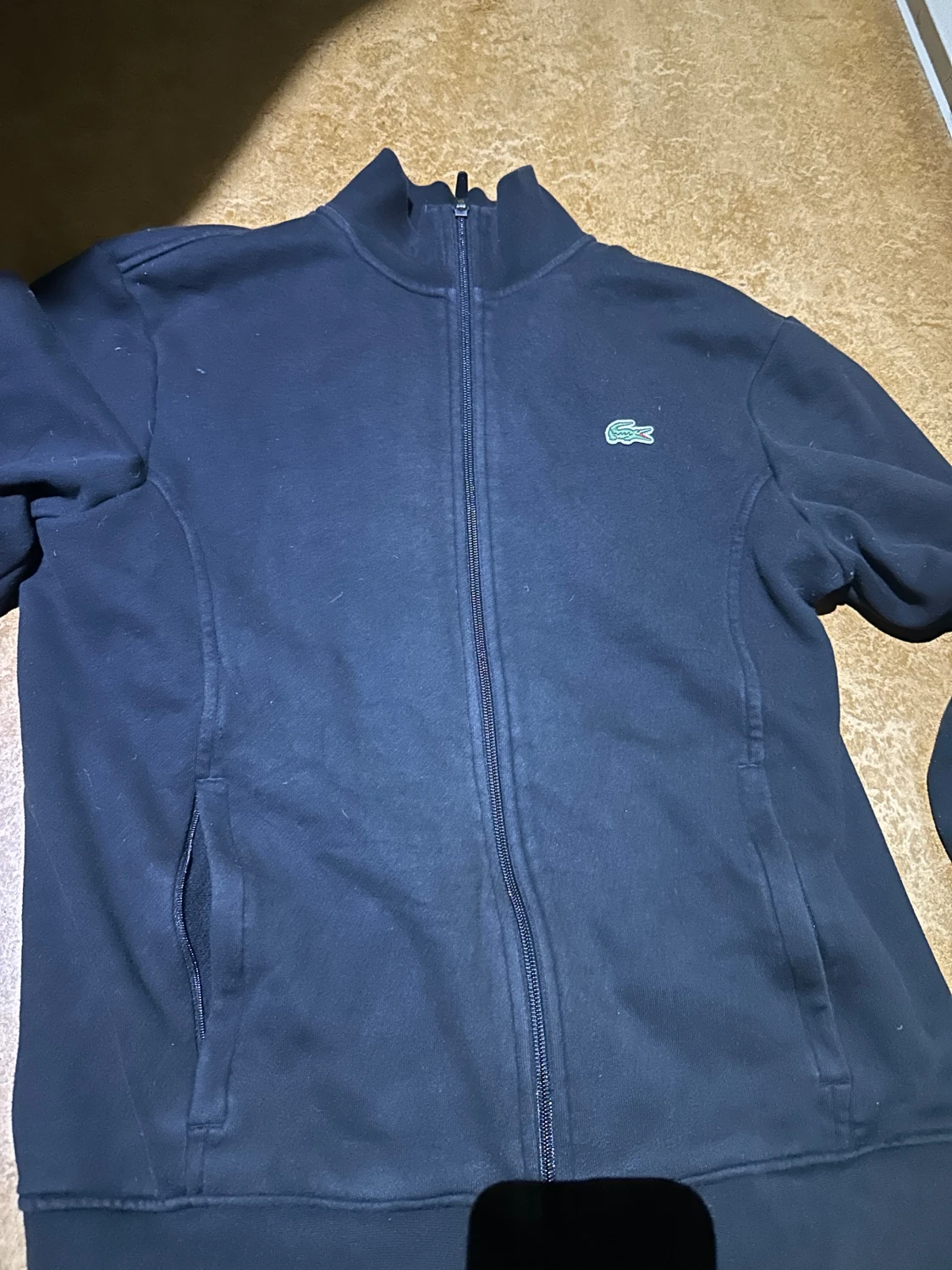 Mörkblå zipjacka från Lacoste Sport