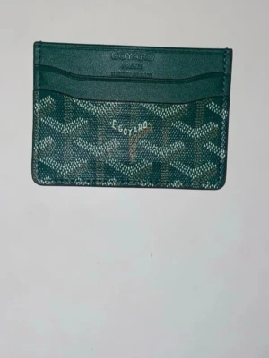 Grön Plånbok - Grön plånbok som är färgat guld färgat inuti..