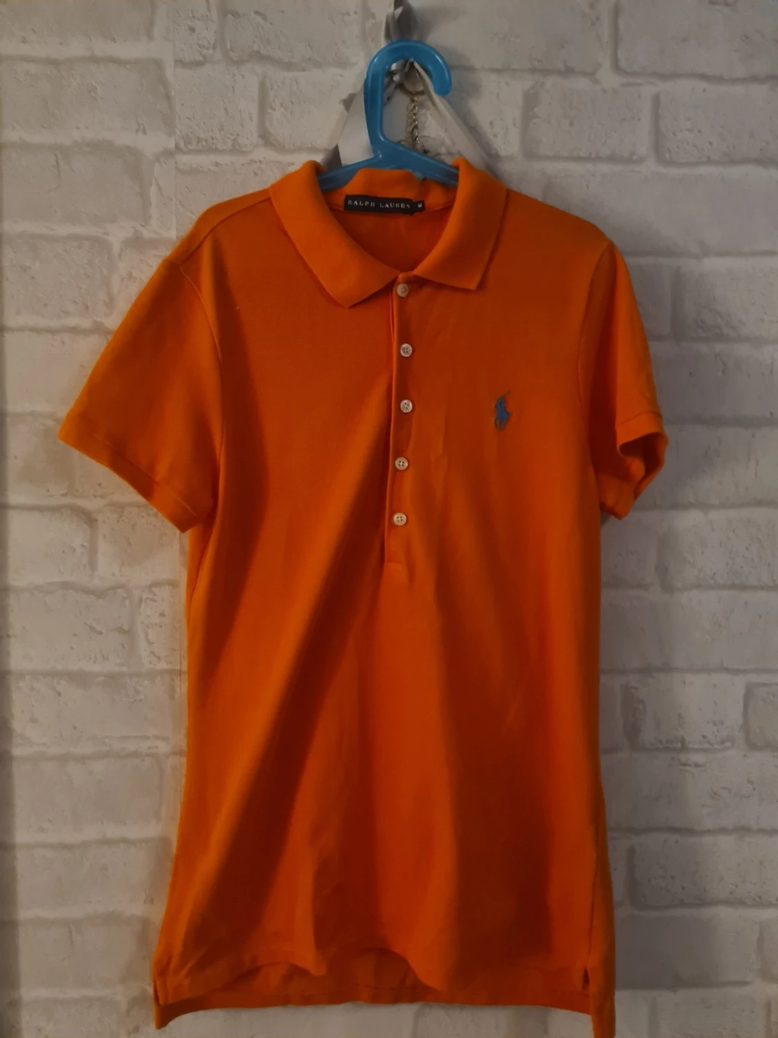 Orange polotopp från Ralph Lauren Storlek M