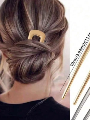 Guldig hårpinne i metall - Stilren hårpinne i guldigt metall med modern, rektangulär form. Perfekt för att skapa snygga uppsättningar och hålla håret på plats. Längd ca 10 cm. Enkel men trendig design som ger en elegant touch till din look.