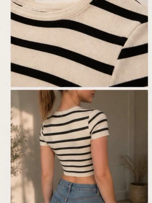 Randig croppad topp i bomull - Trendig croppad topp med svarta och vita ränder. Kortärmad och figurnära passform, perfekt till höga jeans. Tillverkad i mjuk bomull som känns skön mot huden. Enkel men snygg design som passar till många olika stilar.