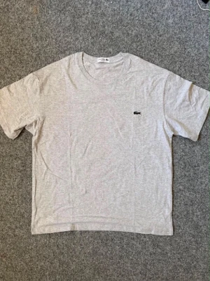 Lacoste gray t shirt - Never used, in amazing condition. Ask DM for more questions and follow insta to join our giveaways!