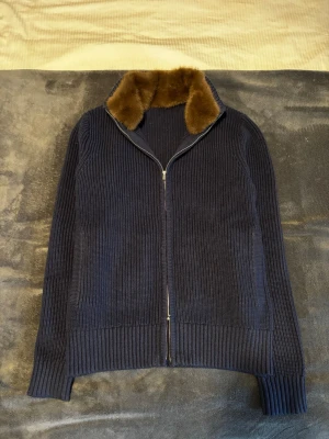 Faux Fur Cashmere Cardigan  - Wool/Cashmere faux fur cardigan. Double zipper, the fur is detachable. Really nice piece you can’t miss to have in your closet. Don’t hesitate to contact me if you have any questions!  Measurements: Arm: 67,5 cm Length: 62 cm Width: 49 cm