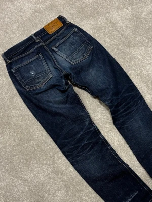 Indigofera Selvage Jeans - Indigofera Selvage Jeans | Modell: Buck | Skick 9/10 mycket bra | *Hål benslut (se bild 4) | Nypris ca 3000kr | Mitt pris 999kr | Midja: 38.5cm | Ytterbenslängd: 106cm | Benöppning: 18cm | Lår: 30cm | Kom gärna pm vid frågor eller funderingar | Postas eller möts upp i Gävle!