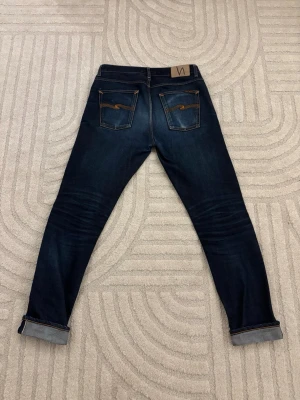  Nudie Jeans dry Japan selvedge  - Jeans från nudie, modell lean dean. W32 L34. Midja mått 42 och längd 106,5. 