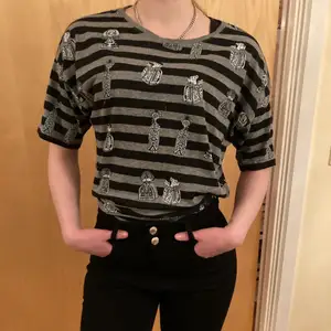 Black and Gray stripsed T-shirt from Monki, size M, with cool unic patterns. Never used, good condition. 