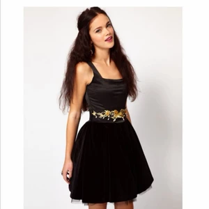 River Island Velvet dress - A very playfully and chick short black dress with gold details. It is a good British brand and used it very few times. It looks like new and has been stored very carefully.
