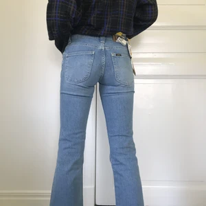 Lee denim jeans - W.26 L.31 Low waist, bootcut, stretch jeans från lee. Oanvända. 