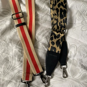 Axelrem  - Två fina axelrem till väskor! Älskar variera band till vissa väskor. Båda säljs för totalt 50kr. 