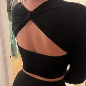 Black crop top with back detail in size small