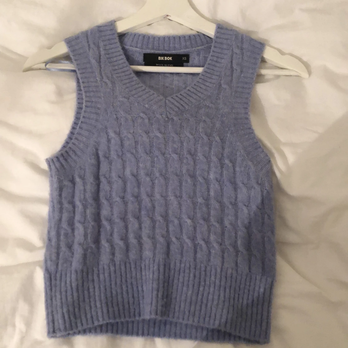 Blå väst ifrån bik bok