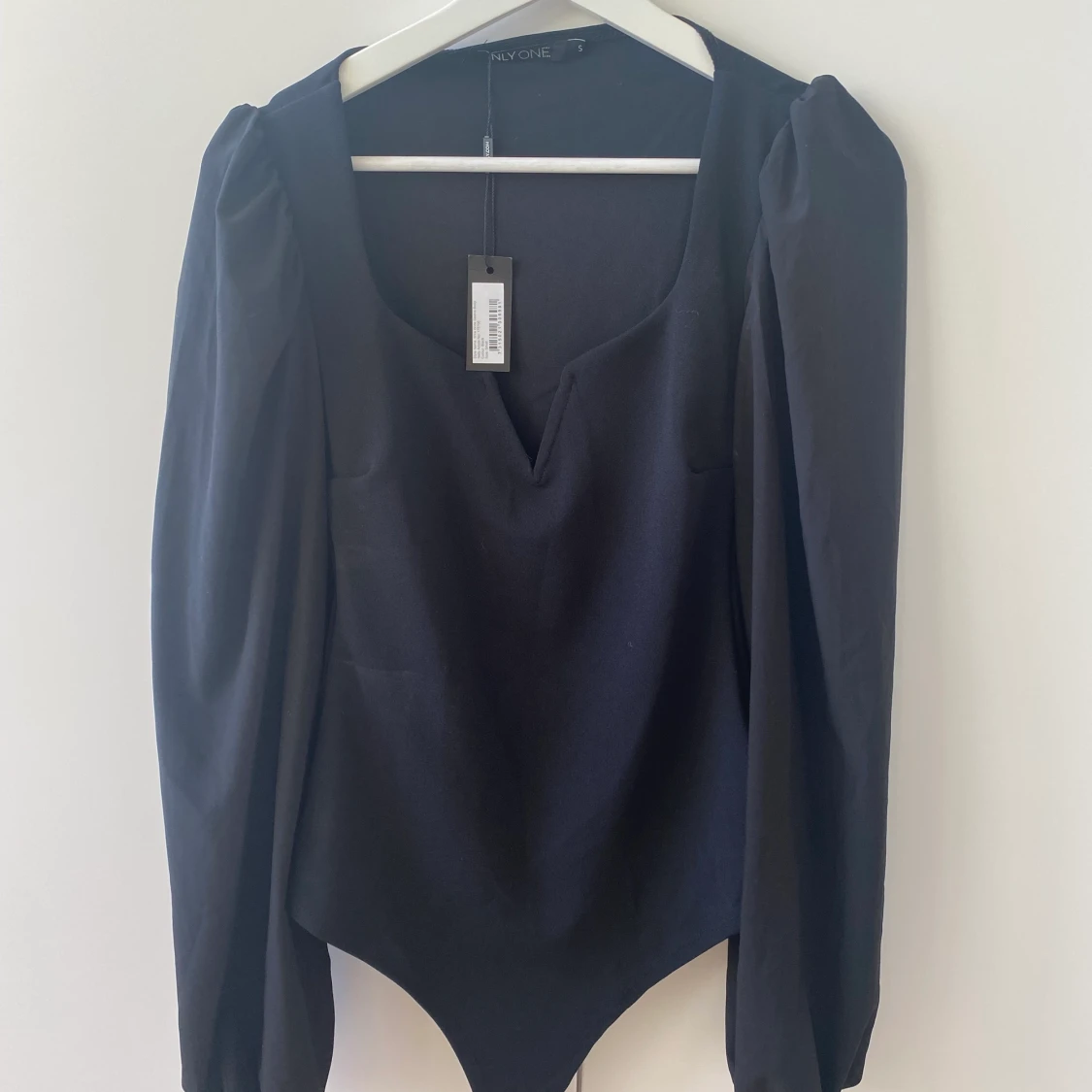 Body med vida armar Small