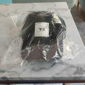 Unused designer Y3 cap!!!! (By Yohio Yamamoto) Purchased ~4 months ago but never touched it (Bought three caps, don't ask haha).  For clearer pictures, search it up on adidas' website 