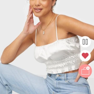 Satintopp från Nelly  - Säljer denna satintoppen från Nelly! Endast använd 1 gång, så den är som ny. 