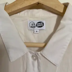 Vintage Cheap Monday shirt with small collar. Slightly pleated arm detail. Short sleeved. Good condition.