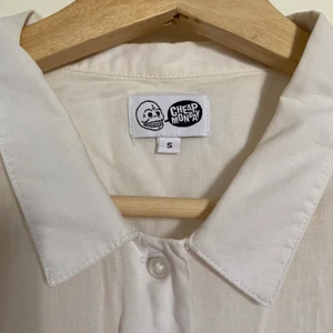 Cheap Monday white shirt - Vintage Cheap Monday shirt with small collar. Slightly pleated arm detail. Short sleeved. Good condition.